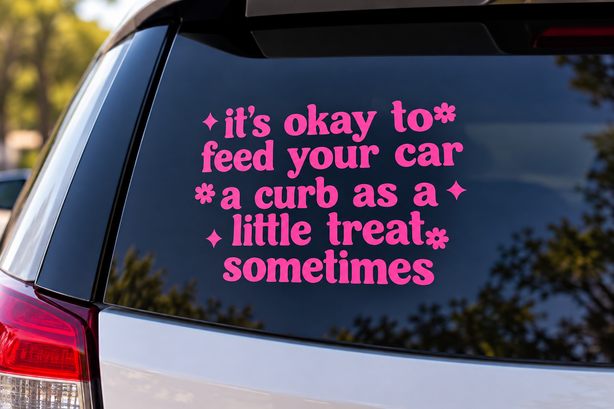 It’s Okay to Feed Your Car a Curb pink vinyl car decal on vehicle window