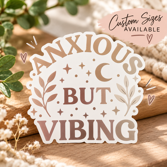 Anxious But Vibing vinyl decal with metallic lettering, a crescent moon, stars, and leafy branches on a neutral background.