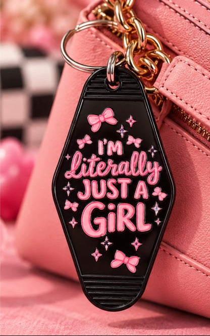 Black I'm Literally Just a Girl double-sided motel keychain with bright pink lettering bows and sparkle details